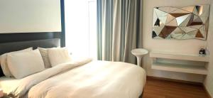 Postel nebo postele na pokoji v ubytování Mirada Hotel