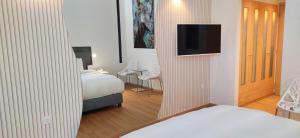 Postel nebo postele na pokoji v ubytování Mirada Hotel
