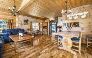 a living room with a wooden ceiling and a dining room at Stunning Home In Eggedal With Kitchen in Eggedal