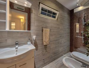 Phòng tắm tại Apartments Villa Mike