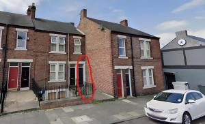 a white car parked in front of a brick building at Rawling - Canny 2 bed flat close to Ncle free wifi & parking in Gateshead