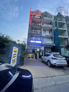 a building with a car parked in front of it at kim'hotel near SECC - FV in Ho Chi Minh City