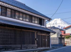 a building with windows on the side of a street at MITSU-House in Nishikatsuracho