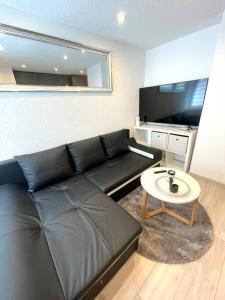 TV a/nebo společenská místnost v ubytování Schöne Wohnung in Unterterzen am schönen Walensee