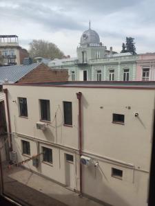 a view of a building from a window at AhmashenebeliApart in Tbilisi City