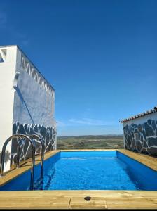 a pool with a view of the ocean from a house at Casa Dona Antonia - Monsaraz in Monsaraz