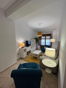 a living room with a couch and a table at Apartamento Camberos Antequera in Antequera