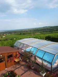 an overhead view of a greenhouse with a swimming pool at Chambre d'hôtes de la tulipe in Mittelbergheim