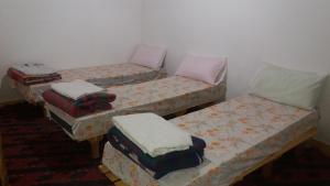 A bed or beds in a room at Gîte Assafar