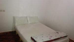 A bed or beds in a room at Gîte Assafar