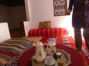 A bed or beds in a room at Gîte Assafar