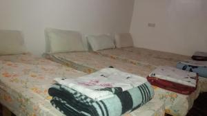 A bed or beds in a room at Gîte Assafar