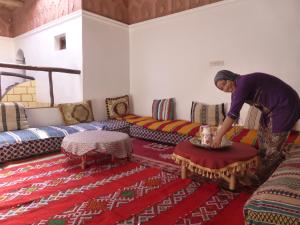 A bed or beds in a room at Gîte Assafar