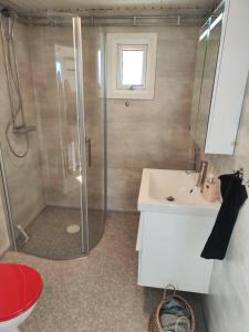 a bathroom with a shower and a sink at Strandskatan 102 in Halmstad