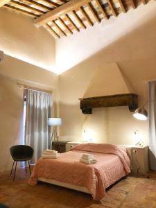 Postel nebo postele na pokoji v ubytování Allegra Toscana - Affittacamere Guest house Arezzo