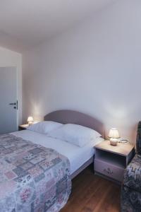 Postel nebo postele na pokoji v ubytování Villa Porta