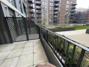 a balcony with a black fence on a building at BrandNew Luxurious 2Bed Apartmnt in Bexleyheath