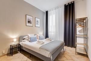 a bedroom with a large bed and a window at Pantheon Boutique Apartment "La Dolce Vita" in Rome