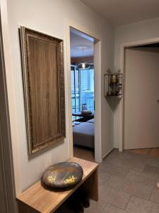 a living room with a bench and a mirror at Savec in Munich