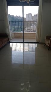 a room with a large window with a view of a building at Masion Lovely Home in Ramallah