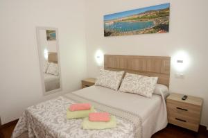 Łóżko lub łóżka w pokoju w obiekcie Casa del Patio Andaluz