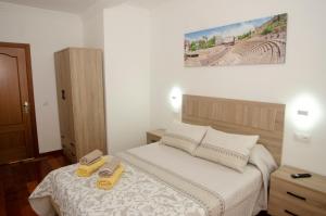 Łóżko lub łóżka w pokoju w obiekcie Casa del Patio Andaluz