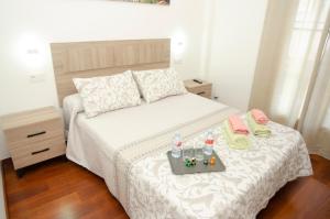Łóżko lub łóżka w pokoju w obiekcie Casa del Patio Andaluz