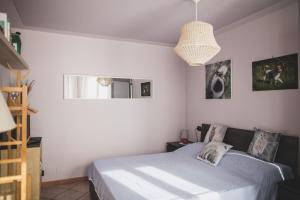 Postel nebo postele na pokoji v ubytování B&B LA MIMOSA E IL GELSOMINO