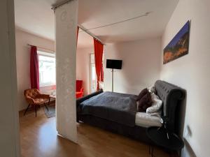 a bedroom with a bed and a mirror at Apartment Gartenstrasse 3 in Ostseebad Sellin