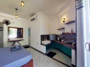 a kitchen with a sink and a counter top at CHEN VILLA - Near Airport in Negombo