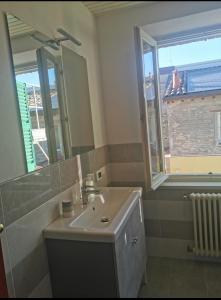a bathroom with a sink and a mirror at B&B La Chicca in Ravenna +18 photos