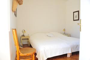 Giường trong phòng chung tại Villa Ana
