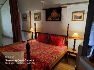 Voodi või voodid majutusasutuse Leela Cottages toas