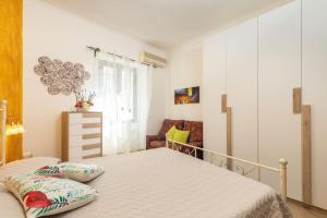 En eller flere senge i et værelse på Orientale 205 Baunei