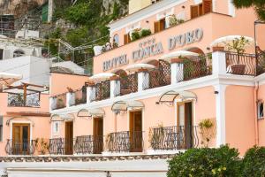 a building in positano with balconies at Hotel Conca d'Oro in Positano