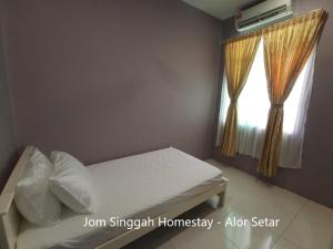 Katil atau katil-katil dalam bilik di Jom Singgah Homestay - Alor Setar
