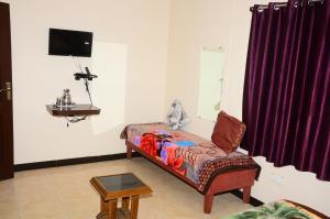 TV a/nebo společenská místnost v ubytování Tree top villa kodaikanal homestay