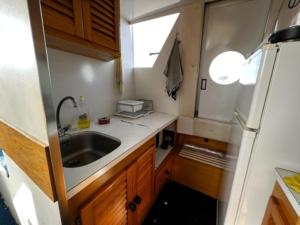 a kitchen with a sink and a refrigerator at Iate Glória Sem-fim Monsaraz in Monsaraz +73 photos