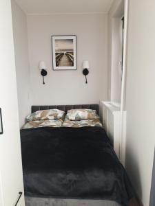 Ένα ή περισσότερα κρεβάτια σε δωμάτιο στο Apartamentai centre