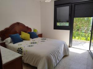 Posteľ alebo postele v izbe v ubytovaní JARDIN, TERRAZA Y BARBACOA