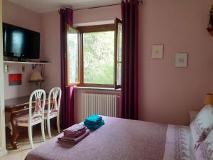 Postel nebo postele na pokoji v ubytování La Casa Più Sù