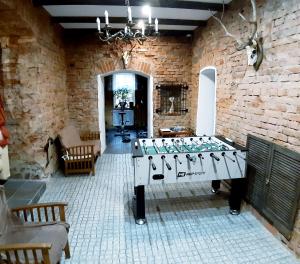 a room with a table in a brick wall at WILLA Jugowice in Jugowice