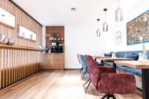 a dining room with a table and chairs at Boardinghouse Plattling in Plattling