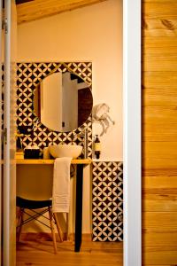 a bathroom with a sink and a mirror at Hotel Casa Luna in Zafra