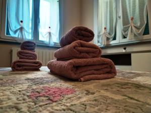 a stack of towels sitting on top of a table at Marino Apartments in Levanto