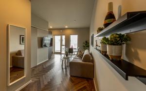 a living room with a couch and a table at Iceland SJF Apartments - 503 in Reykjavík