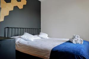 Postel nebo postele na pokoji v ubytování Apartament 914