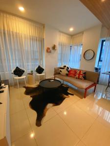 a living room with a couch and a table at Kuala Lumpur Arte 3Bedrooms Master Residence in Kuala Lumpur