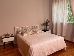 En eller flere senge i et værelse på Casa centríca accesible a los lugares más turísticos + 14 billeder