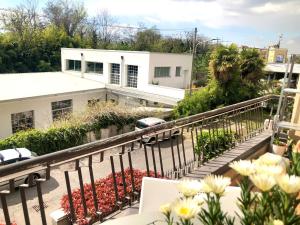a balcony of a house with flowers on it at Serenity B&B in Brescia